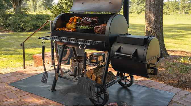 Oklahoma Joe's Grill sitting on a patio with patio furniture